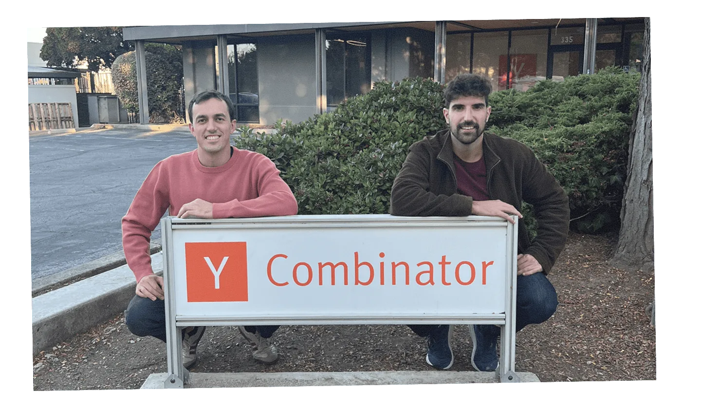 Toni Lopez and Pablo Omenaca, Karumi's founders, holding a Y Combinator sign
